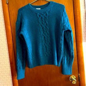 Teal colored cable knit sweater for women